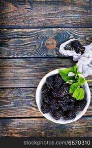 blackberry in the bowl and on a table