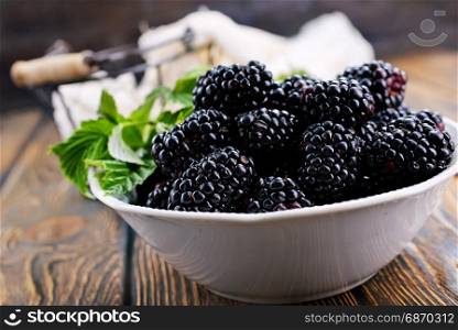 blackberry in the bowl and on a table