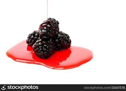 blackberry pile in syrup isolated on white