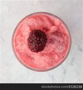 Blackberry smoothie on a white. Blackberry smoothie on a white concrete background. Square cropping