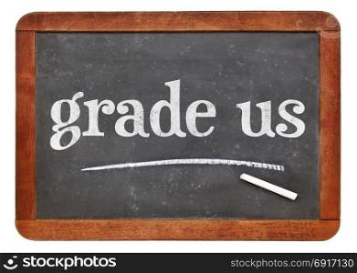 blackboard. grade us - feedback request, white chalk text on a vintage slate blackboard