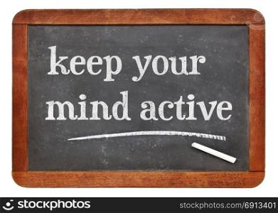 blackboard. Keep your mind active adviice - white chalk text on a vintage slate blackboard