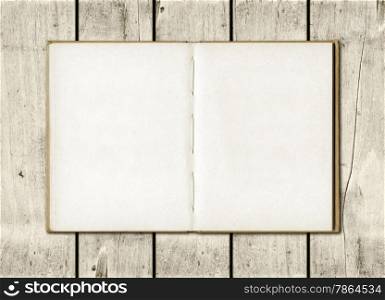 Blackboard on a old white wood wall background texture. Note book on a white wood background
