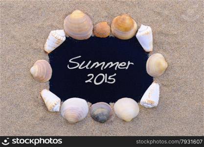 Blackboard on the beach with the phrase Summer 2015.