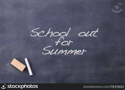 Blackboard with the phrase School out for summer.