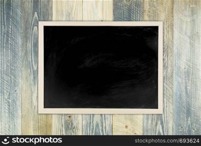 blackboard with wooden frame, blackboard on old wood background for education concept.