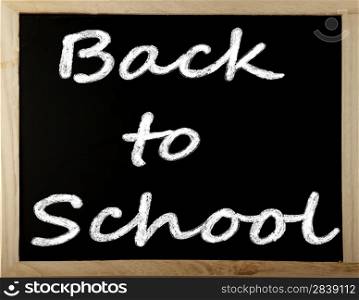 "Blackboard with words "back to school" written with chalk"