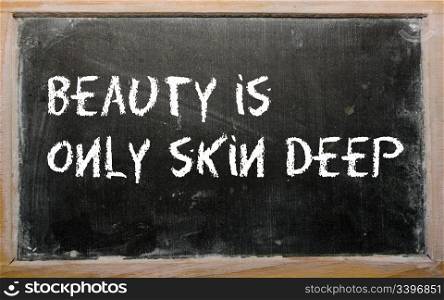 "Blackboard writings "Beauty is only skin deep""