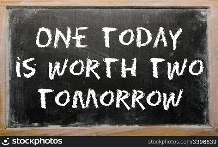 "Blackboard writings "One today is worth two tomorrow""