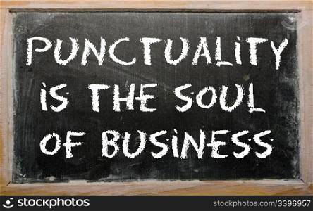 "Blackboard writings "Punctuality is the soul of business""