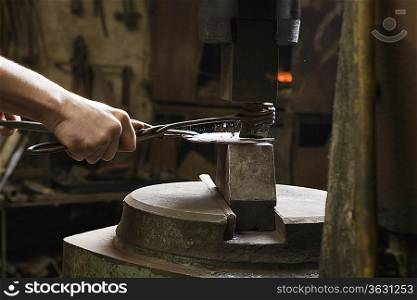 Blacksmith Shaping Metal