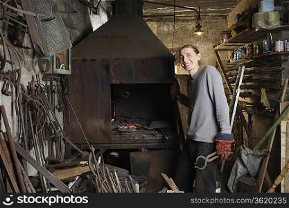 Blacksmith Standing by Forge