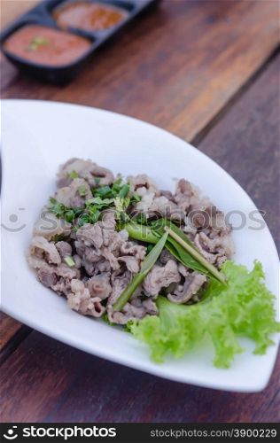 Blanched meat. Blanched beef served with fresh green vegetable