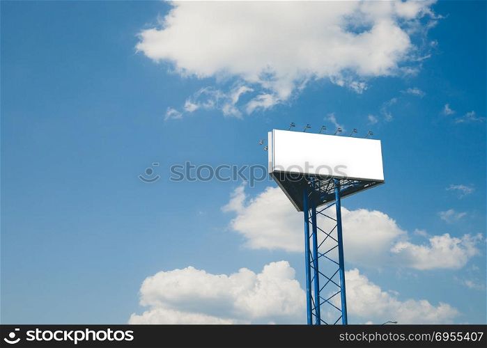Blank billboard against blue cloudy sky. Blank big billboard against blue cloudy sky