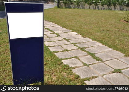 blank billboard and stone walkway in the park