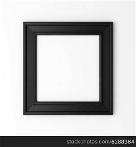 blank black photo frame on white wall