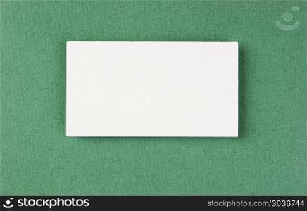 blank business card on a green background