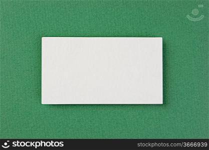 blank business card on a green background