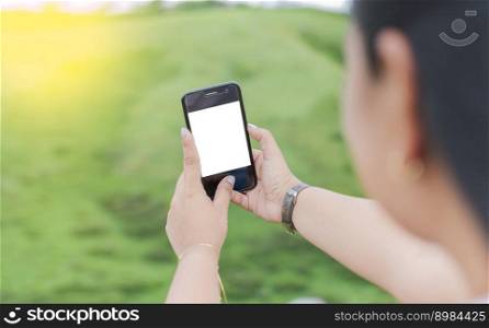 Blank cell phone screen of a girl taking a selfie. Mockup of a person Hand Holding Mobile Phone With Blank Screen And Making Selfie