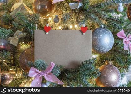 Blank Christmas card or invitation in decorated Christmas tree. Space for copy. Holiday,gift,present background concept space for text. Blank Christmas card or invitation in decorated Christmas tree. Space for copy. Holiday,gift,present background concept