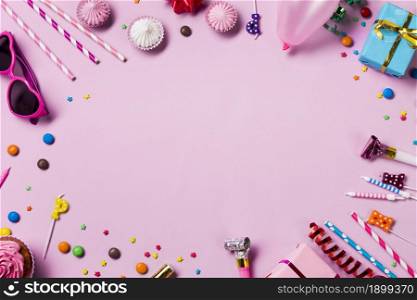 blank circular frame made with birthday party items pink background. Resolution and high quality beautiful photo. blank circular frame made with birthday party items pink background. High quality beautiful photo concept