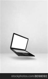 Blank computer laptop floating over a white background. 3D isolated illustration. Vertical template. Floating computer laptop isolated on white. Vertical background