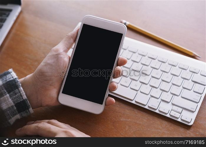 Blank digital smartphone in the hand of Asian women, Mobile phone black screen