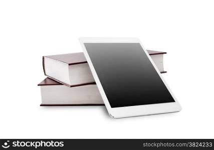 blank digital tablet and stack of books