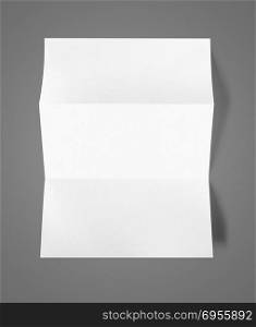 Blank folded White A4 paper sheet mockup template isolated on dark grey background. Blank folded White A4 paper sheet mockup template
