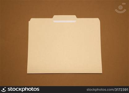 Blank folder on brown blackground.