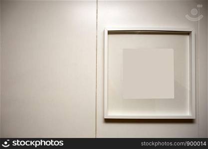 blank frame on a white wall, space for text background texture clean interior. blank frame on a white wall, space for text background texture