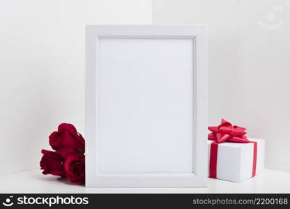 blank frame with gift box red roses