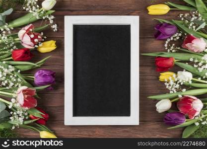 blank frame with white border colorful tulips baby s breath flower wooden desk
