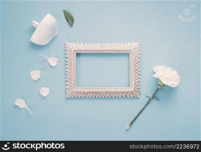 blank frame with white flower perfume