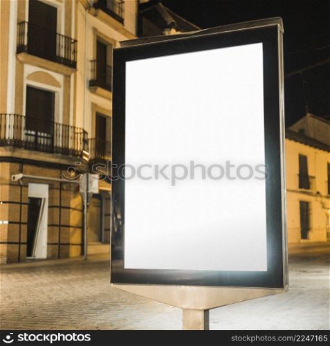 blank illuminated vertical billboard night