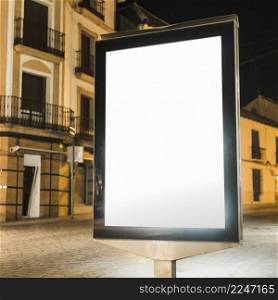 blank illuminated vertical billboard night