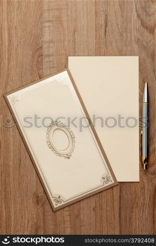 Blank invitatiion card on wood table