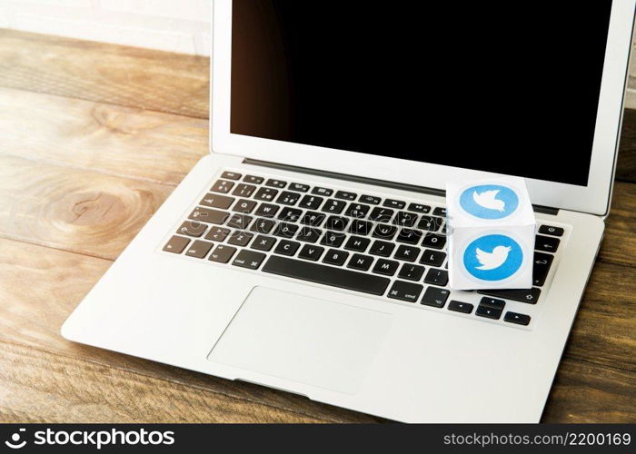 blank laptop with box twitter icon work desk