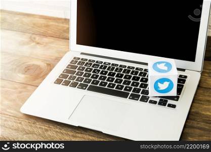 blank laptop with box twitter icon work desk