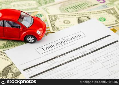 Blank loan application form with car model and money: dollar banknotes on background