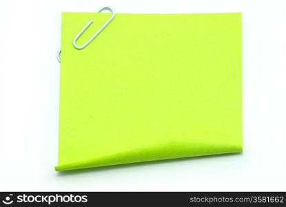 Blank note paper and red paper-clip isolated on white