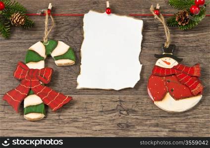 blank note with christmas decoration on wooden background