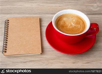 blank notebook and coffee cup on wood table. Motivation, Resolution, To do list, Strategy and Plan concept