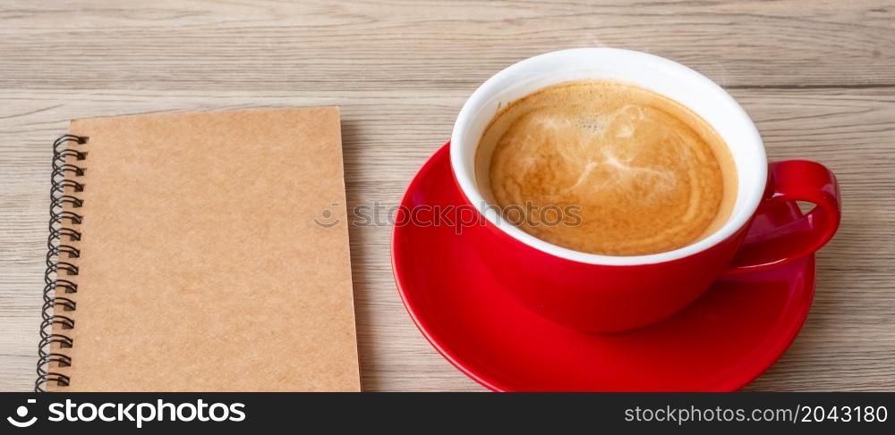 blank notebook and coffee cup on wood table. Motivation, Resolution, To do list, Strategy and Plan concept