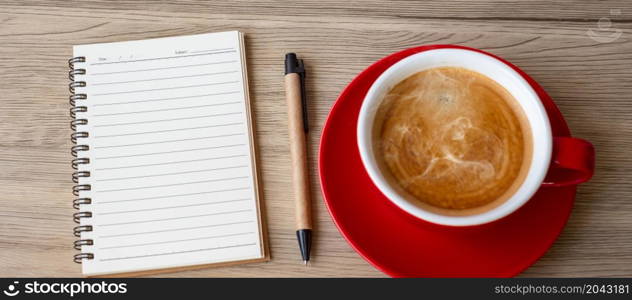 blank notebook and coffee cup on wood table. Motivation, Resolution, To do list, Strategy and Plan concept