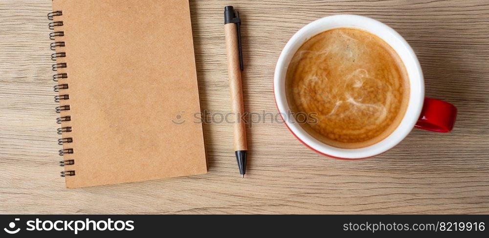 blank notebook and coffee cup on wood table. Motivation, Resolution, To do list, Strategy and Plan concept