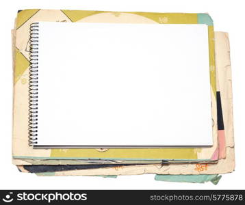 Blank notebook and old paper sheet on a white background