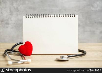 blank notebook and stethoscope for copy space your text. healthcare, Insurance, Wellness and medical concept