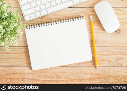 Blank notebook and yellow pencil on brown wood,Flat lay photo of notebook for your message