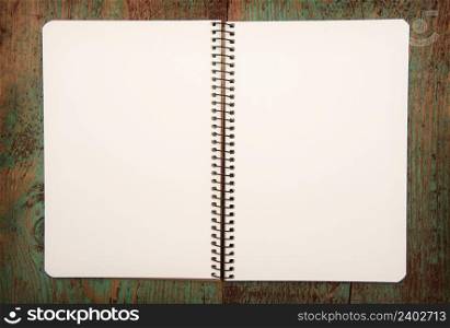 blank notebook on wooden table.